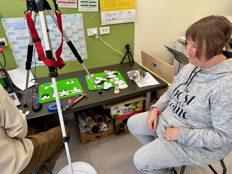 Artist Andrea Monds sits at a desk, learning about animation techniques